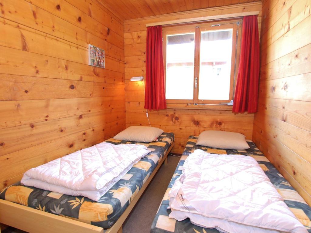 Postel nebo postele na pokoji v ubytování Chalet in Wiler near Ski Lift & Views
