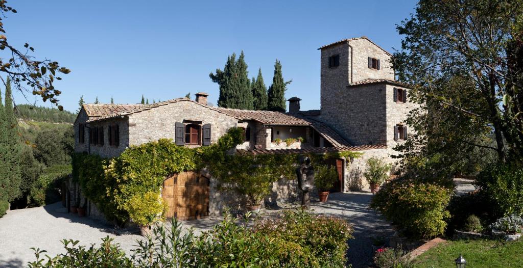 an estate in the hills with a large stone house at Nittardi in Castellina in Chianti