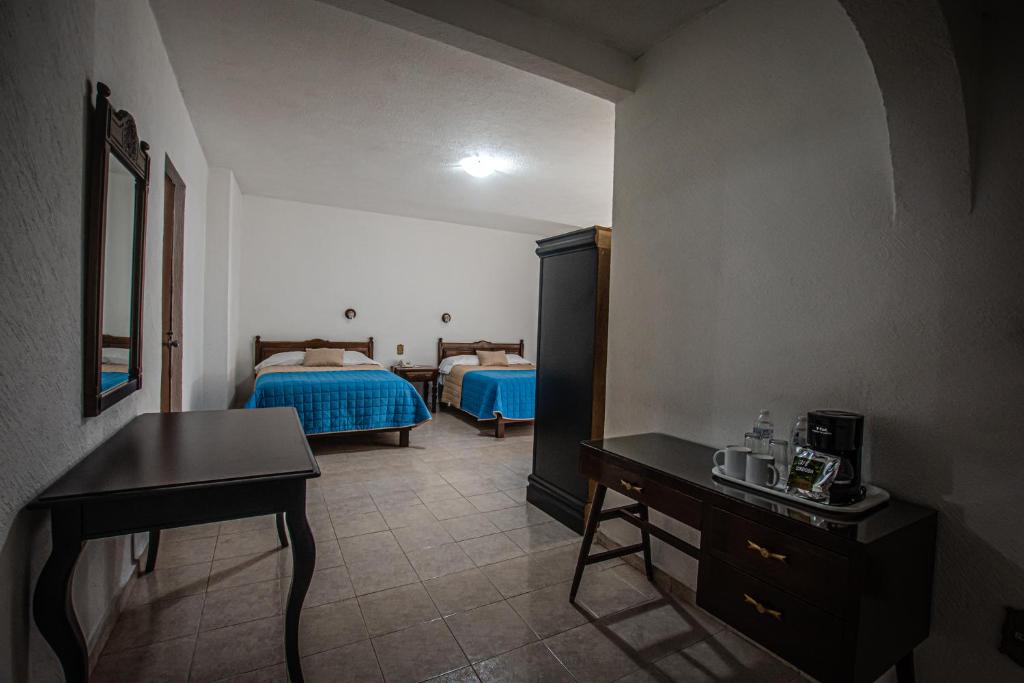 Postel nebo postele na pokoji v ubytování Hotel Palacio