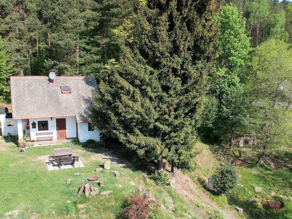 an aerial view of a house with a picnic table at small holiday home at the edge of the forest in Malá Skála