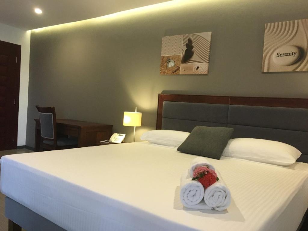 Postel nebo postele na pokoji v ubytování Curacao Suites Hotel