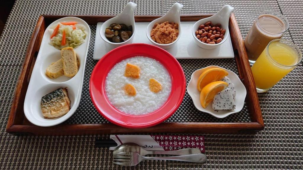 a tray of food with rice and fruits and other foods at Miller Home in Yuchi