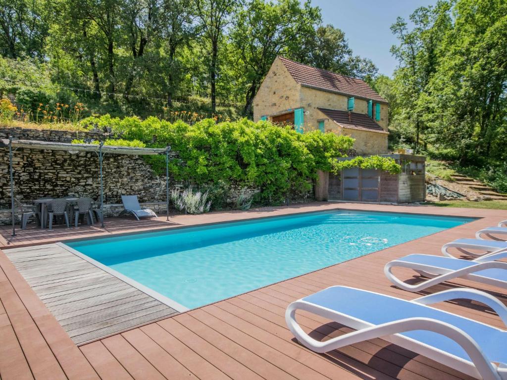 a swimming pool with chairs and a house at Mansion in Lavercanti re with Private Pool in Lavercantière