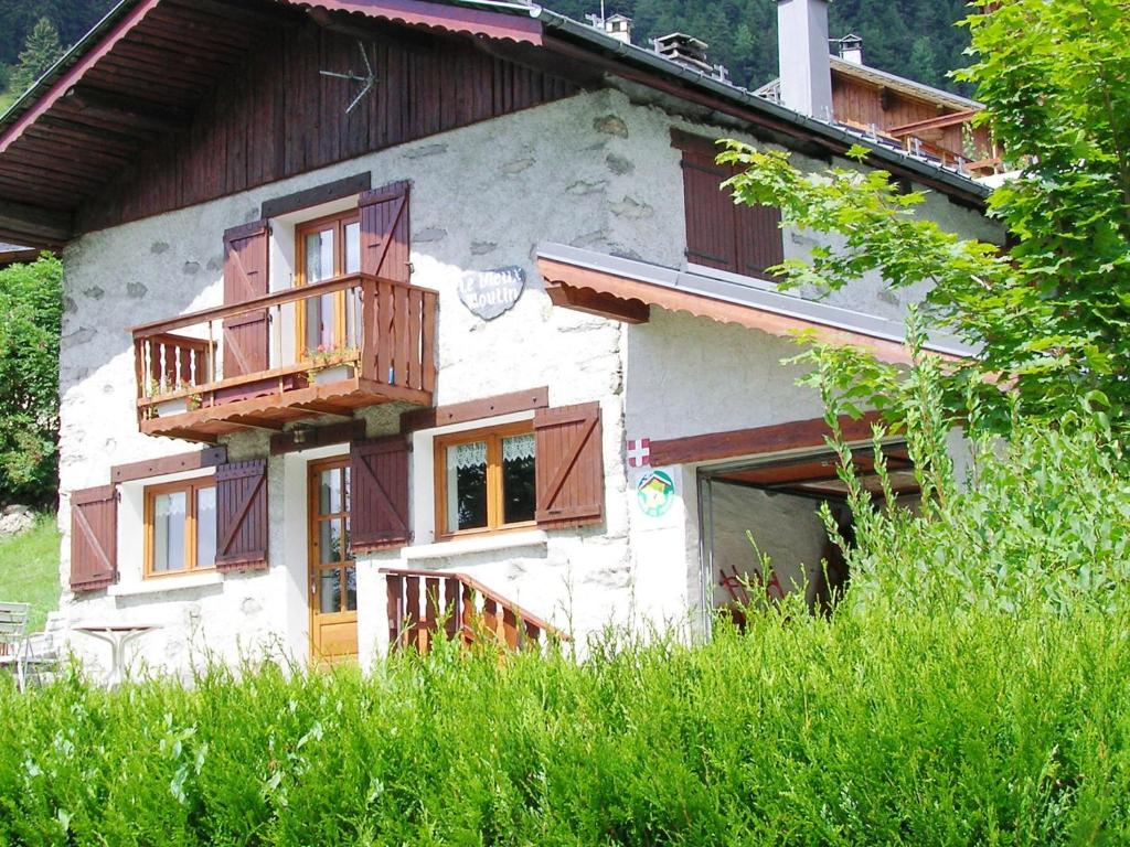 a house with wooden balconies on the side of it at Charming Chalet in Champagny en Vanoise near Ski Area in Le Villard