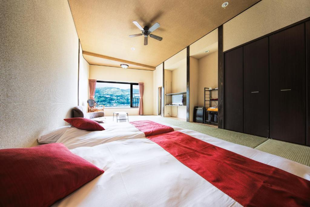 Postel nebo postele na pokoji v ubytování Inatori Akao Hotel