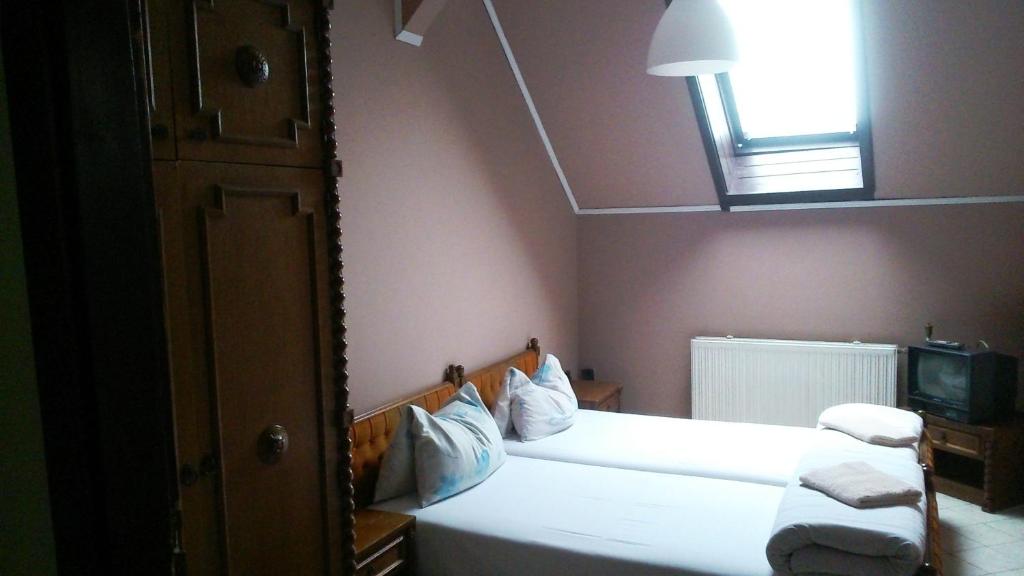 Postel nebo postele na pokoji v ubytování Hotel Palota