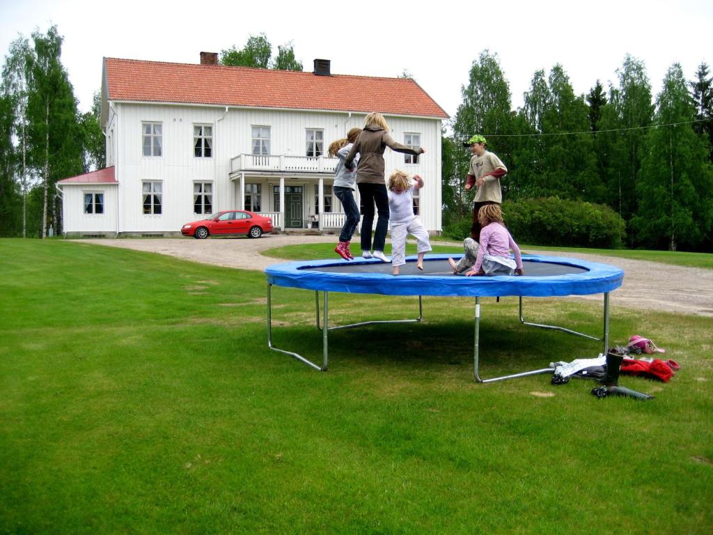 a group of people playing on a trampoline at Beautiful Holiday Home in Syssleb ck with Sauna in Sysslebäck