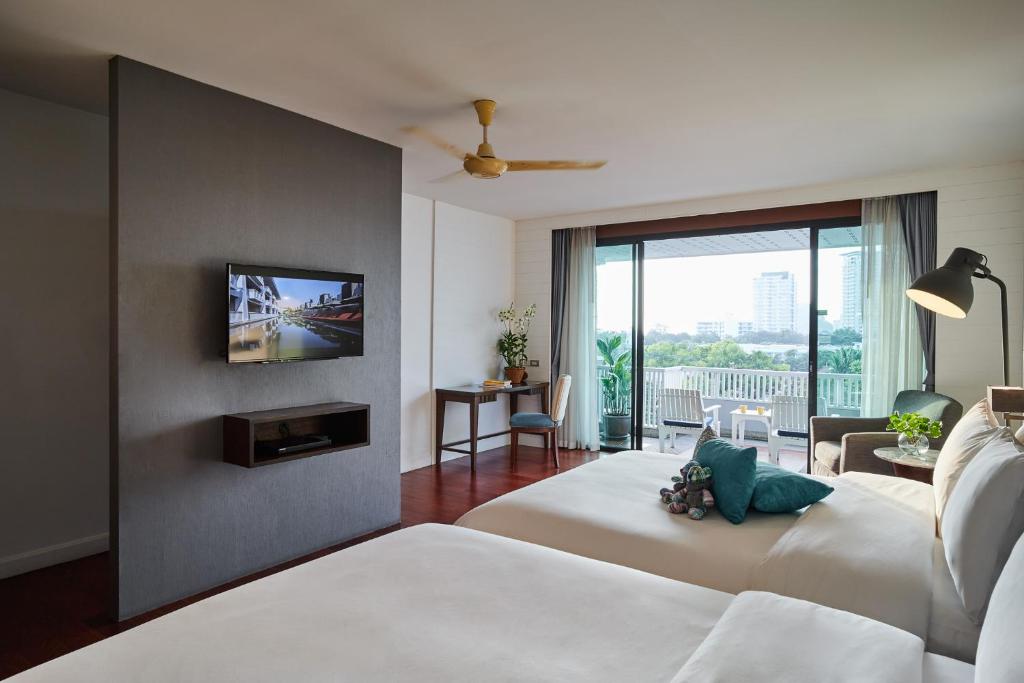 Postel nebo postele na pokoji v ubytování Loligo Resort Hua Hin
