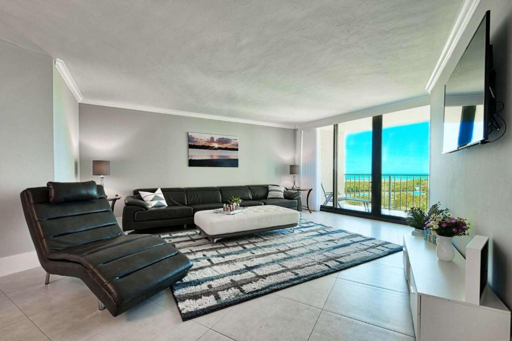 a living room with a couch and a table at SSt3 #701 in Marco Island