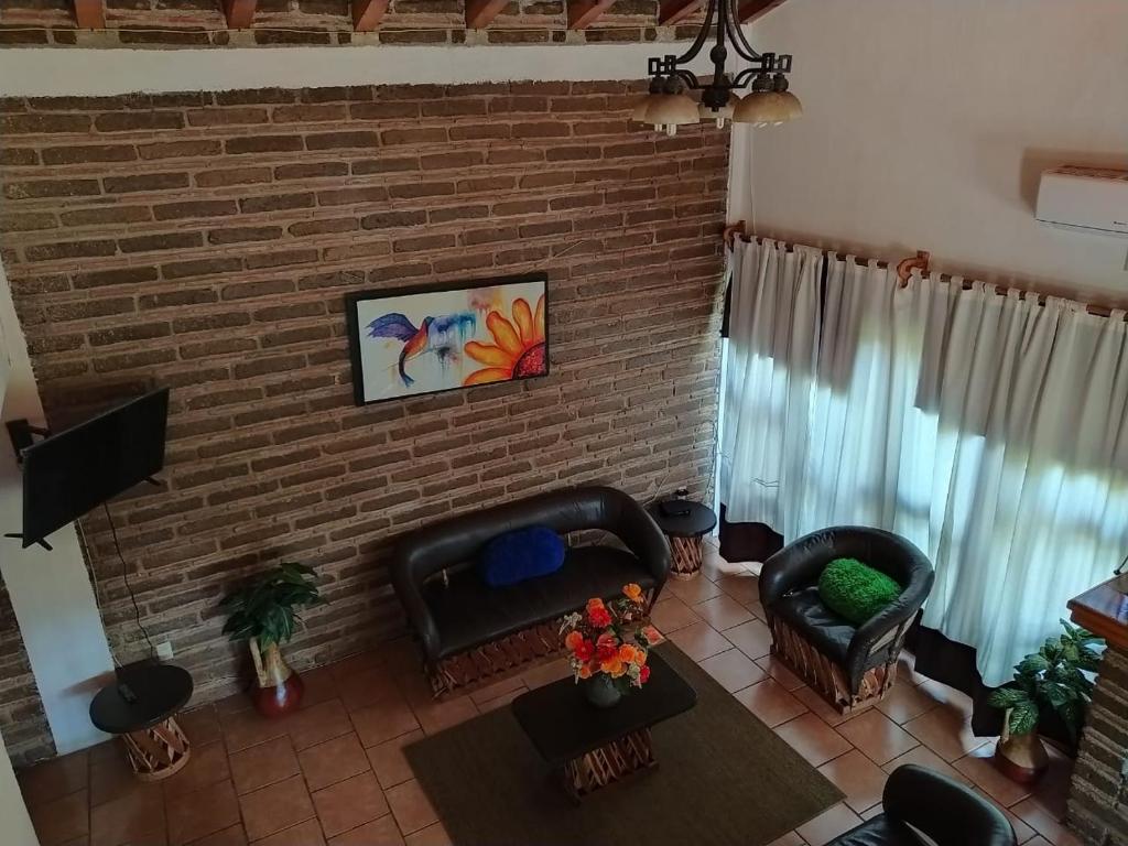 TV a/nebo společenská místnost v ubytování Cabaña "La Matera"