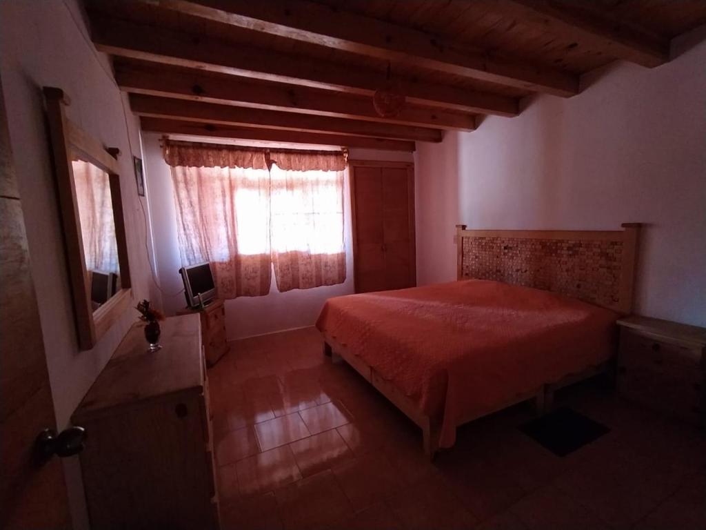 Postel nebo postele na pokoji v ubytování Cabaña "La Matera"