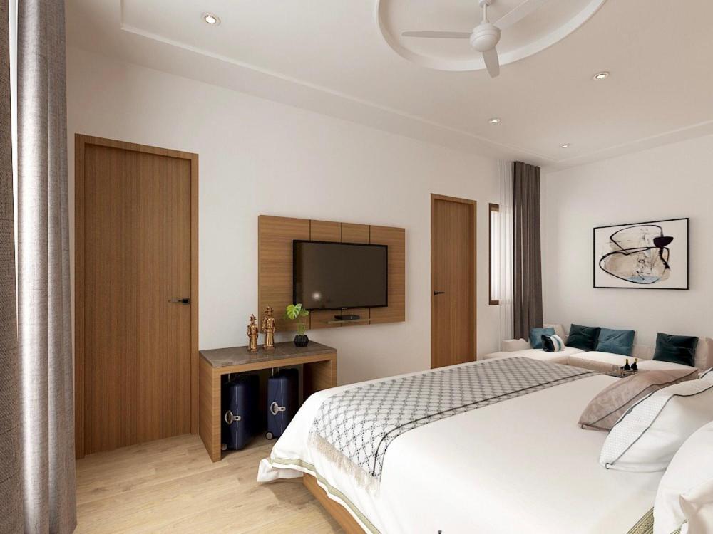 Postel nebo postele na pokoji v ubytování Hotel Bhoomivilas
