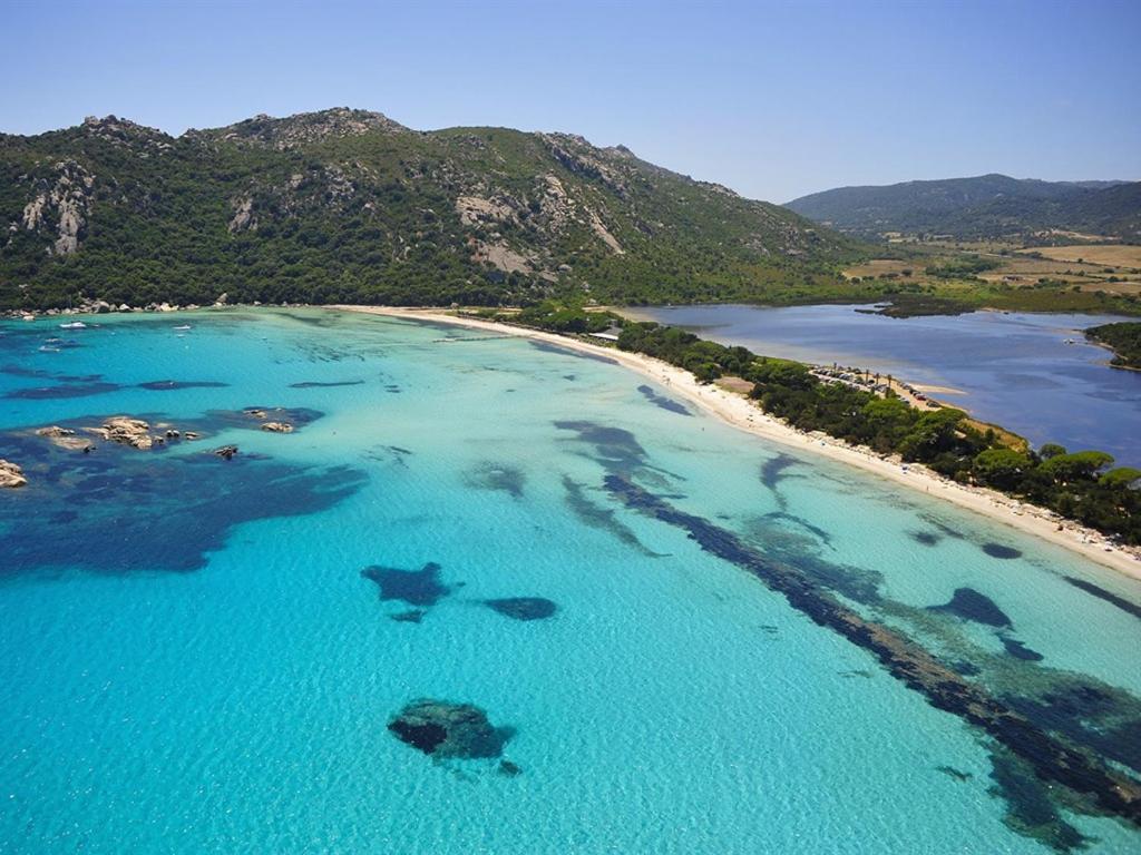 an aerial view of a beach with sharks in the water at Les Mini-Villas de Santa Giulia in Porto-Vecchio