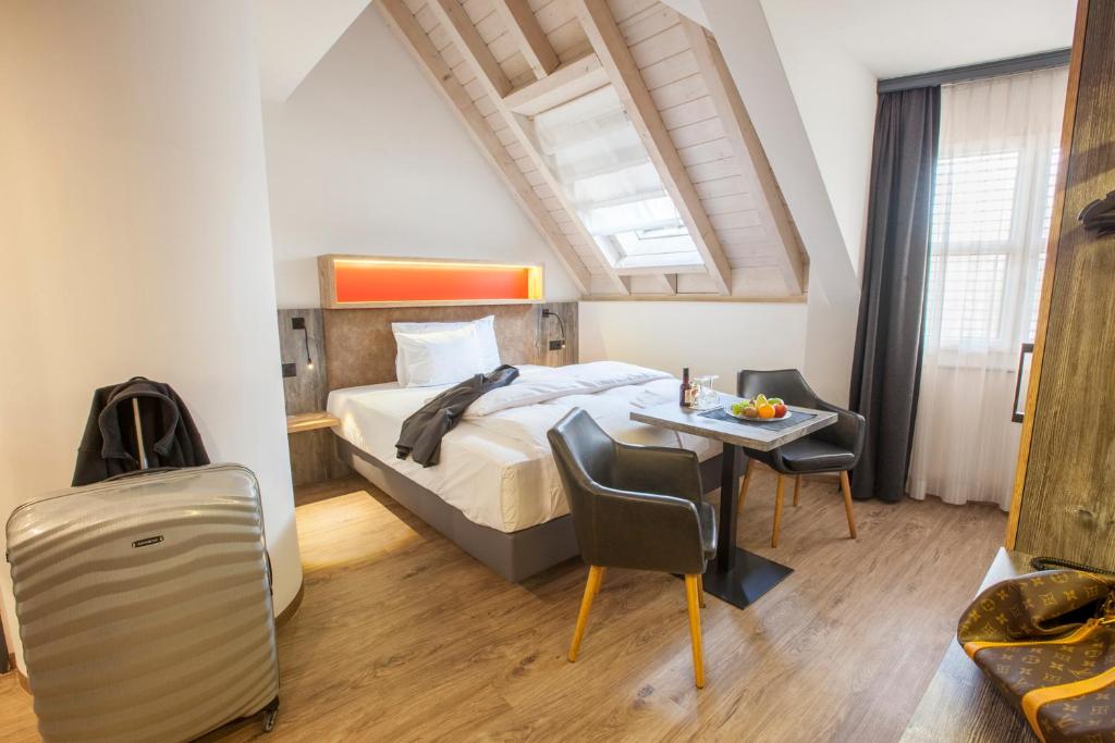 Postel nebo postele na pokoji v ubytování Boutiquehotel Thessoni Classic & Self service Residence Home Zürich