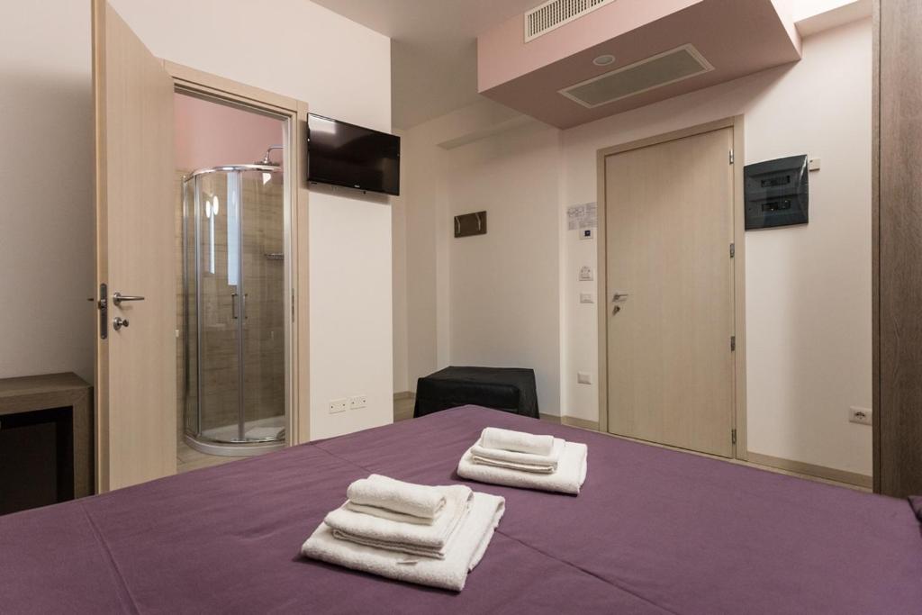 Postel nebo postele na pokoji v ubytování Hotel Gioia