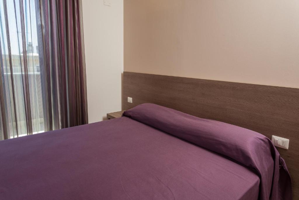 Postel nebo postele na pokoji v ubytování Hotel Gioia