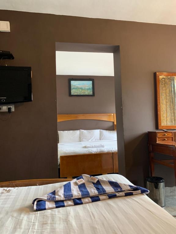Postel nebo postele na pokoji v ubytování Hotel Jc Grand