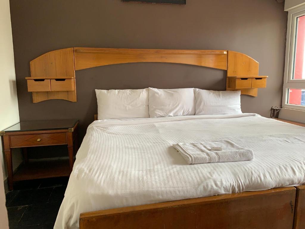 Postel nebo postele na pokoji v ubytování Hotel Jc Grand