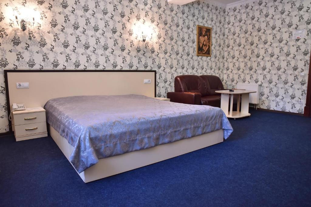 Postel nebo postele na pokoji v ubytování Hotel Т2