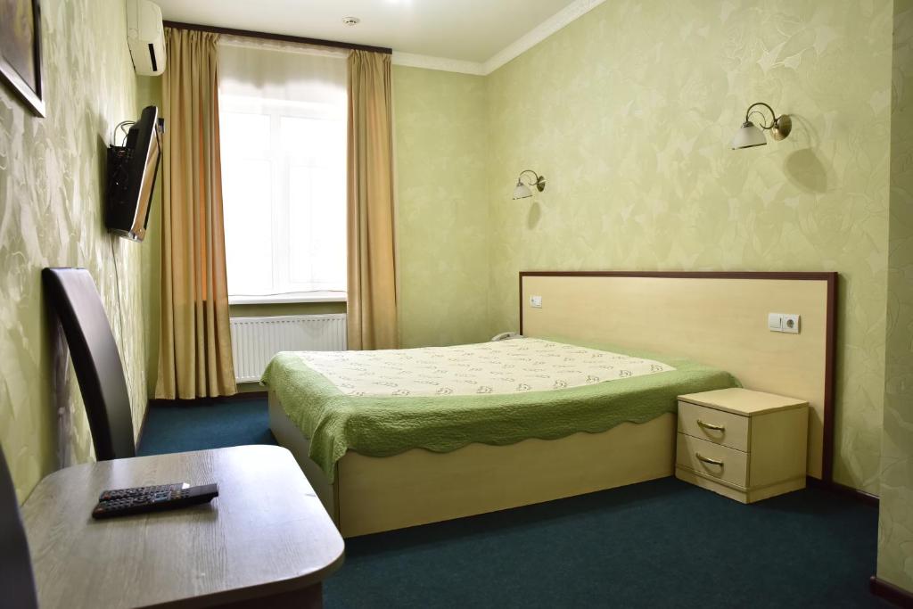 Postel nebo postele na pokoji v ubytování Hotel Т2