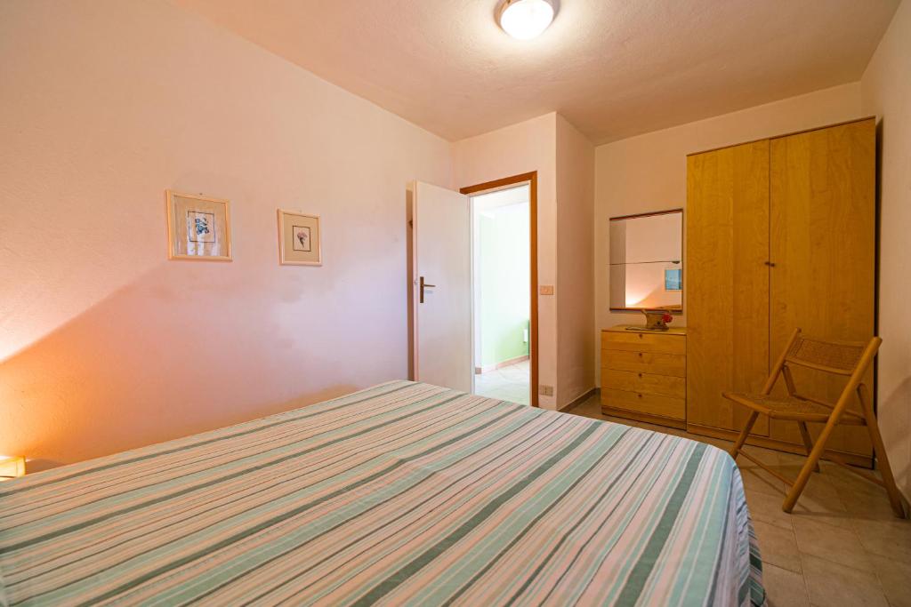 Łóżko lub łóżka w pokoju w obiekcie Appartamenti Vista Mare - Goelba
