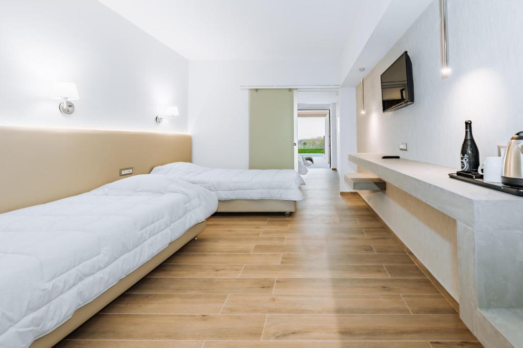 Postel nebo postele na pokoji v ubytování Kresten Palace Hotel