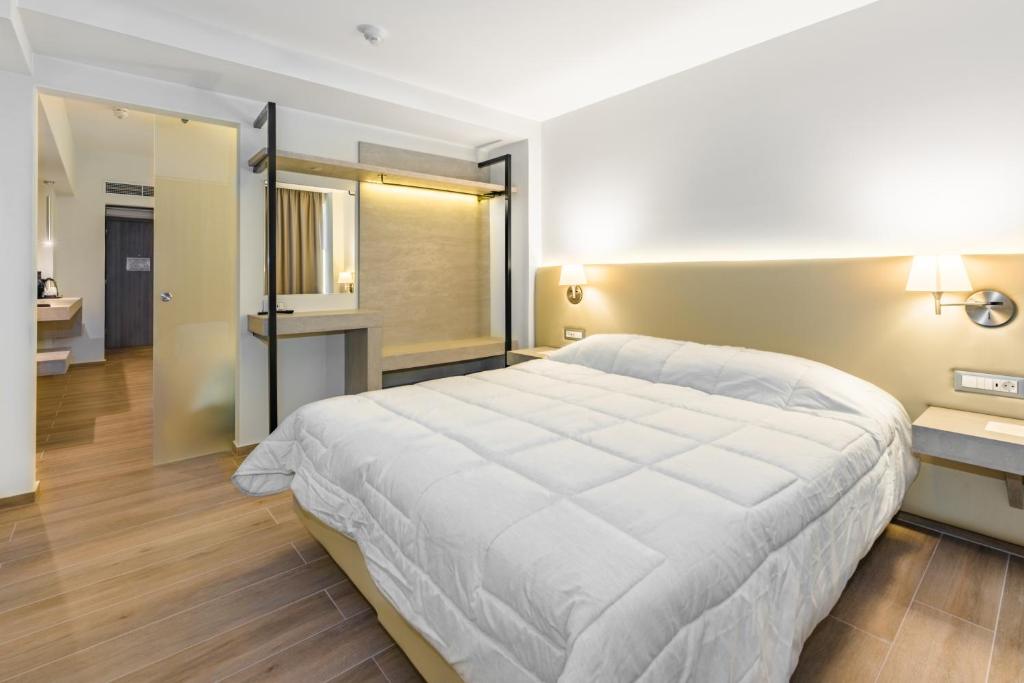 Postel nebo postele na pokoji v ubytování Kresten Palace Hotel