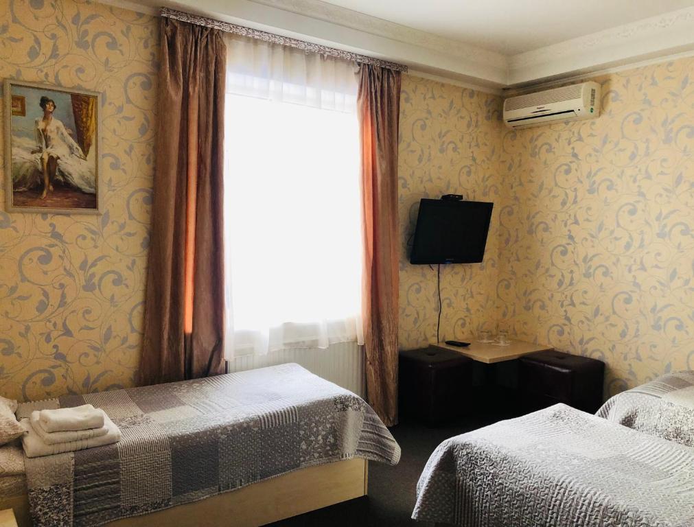 Postel nebo postele na pokoji v ubytování Hotel Т2
