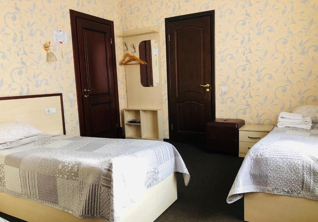 Postel nebo postele na pokoji v ubytování Hotel Т2