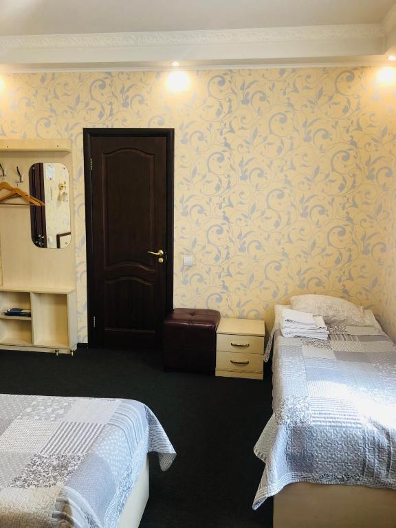 Postel nebo postele na pokoji v ubytování Hotel Т2