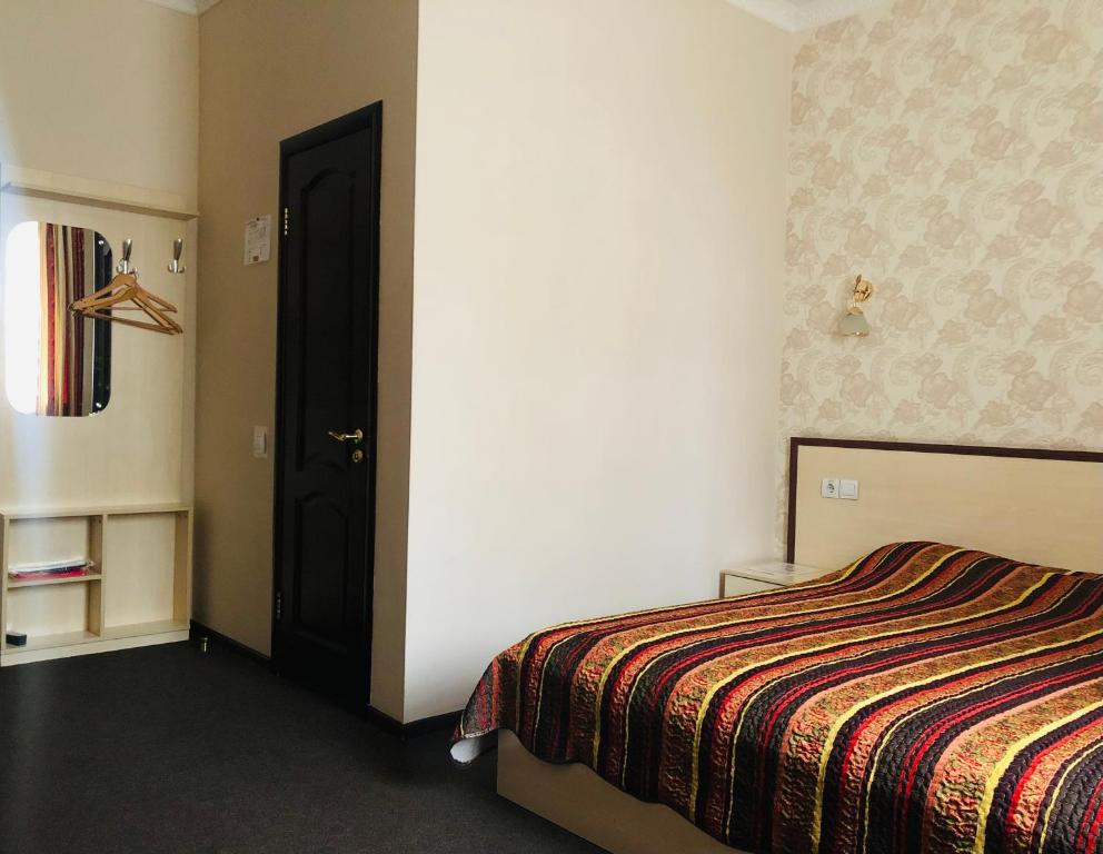 Postel nebo postele na pokoji v ubytování Hotel Т2
