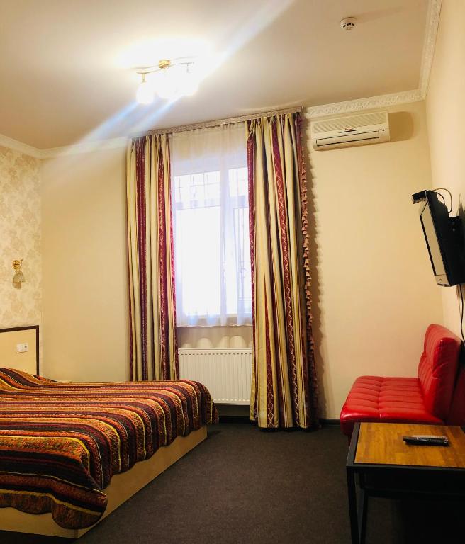 Postel nebo postele na pokoji v ubytování Hotel Т2