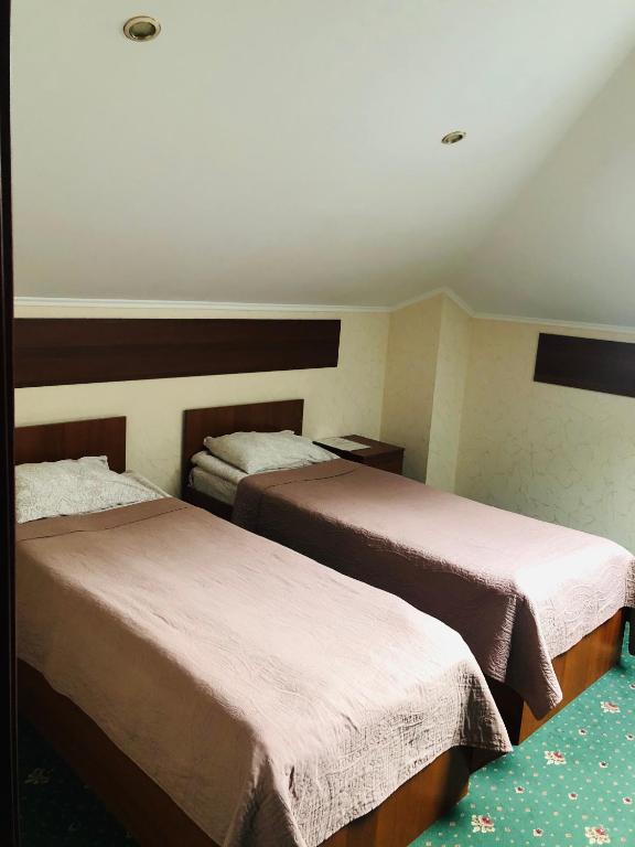 Postel nebo postele na pokoji v ubytování Hotel Т2