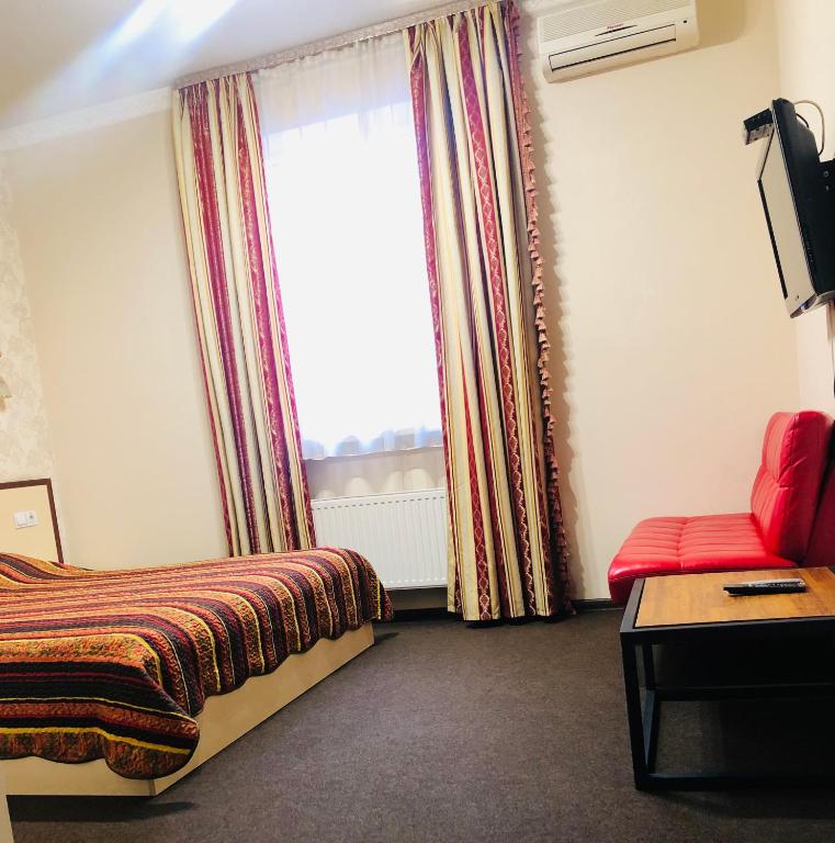 Postel nebo postele na pokoji v ubytování Hotel Т2