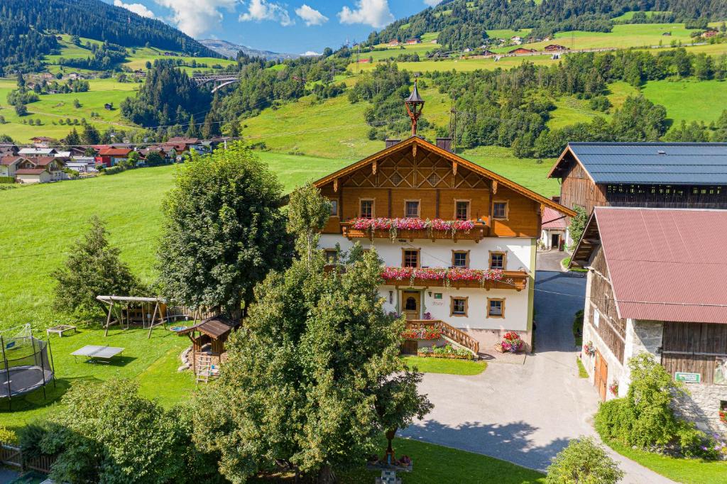 an aerial view of a house in the mountains at Stubnerbauer in Bad Hofgastein