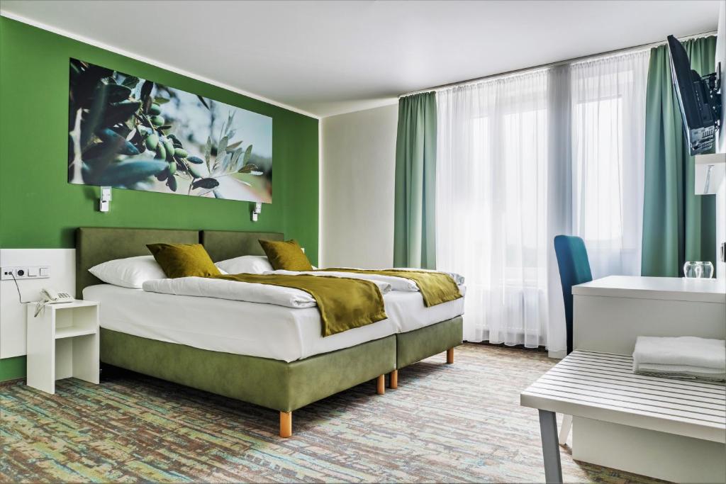 Postel nebo postele na pokoji v ubytování Hotel Atlantis