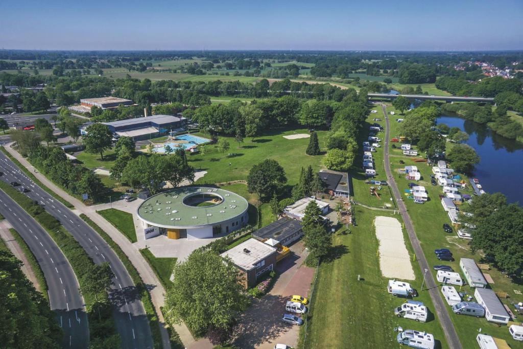 an aerial view of a parking lot next to a river at KNAUS Campingpark Meppen in Meppen
