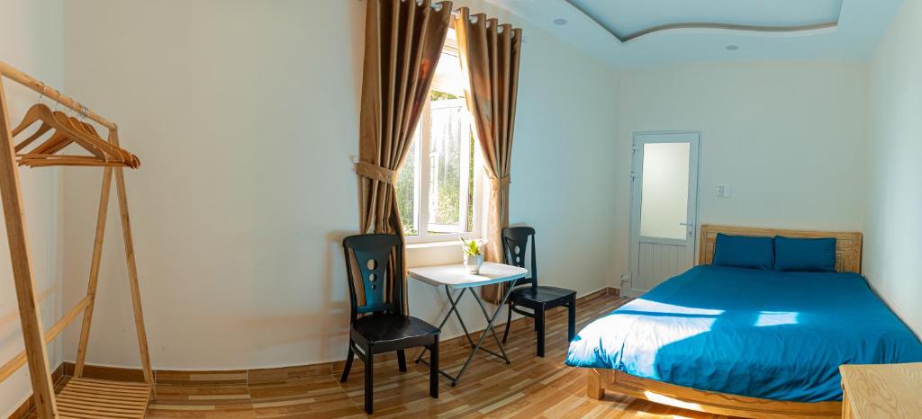 Postel nebo postele na pokoji v ubytování Caly homestay