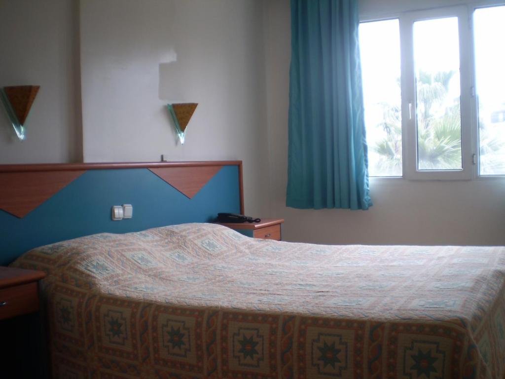 Postel nebo postele na pokoji v ubytování Blue Yacht Marina Apart Hotel