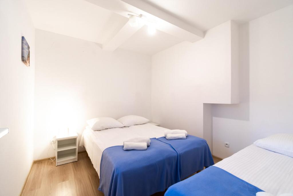 Posteľ alebo postele v izbe v ubytovaní Apartamenty Poddąbek- basen kryty, sauna, animacje dla dzieci , małpi gaj, baseny na dachu