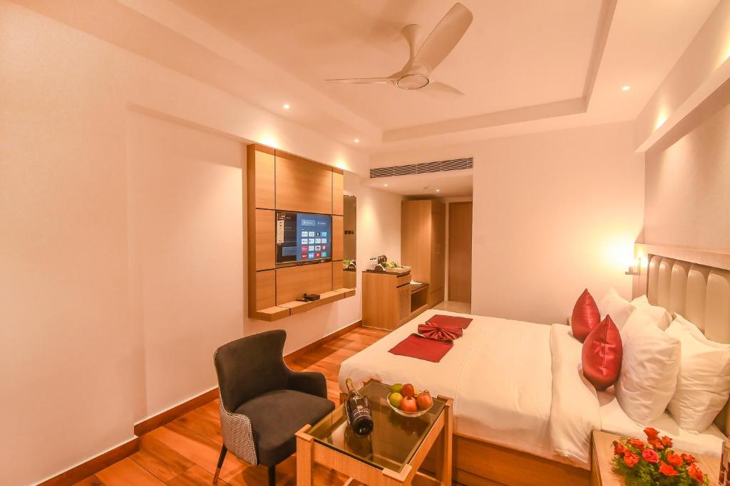 Postel nebo postele na pokoji v ubytování Emerald Clarks Inn Suites