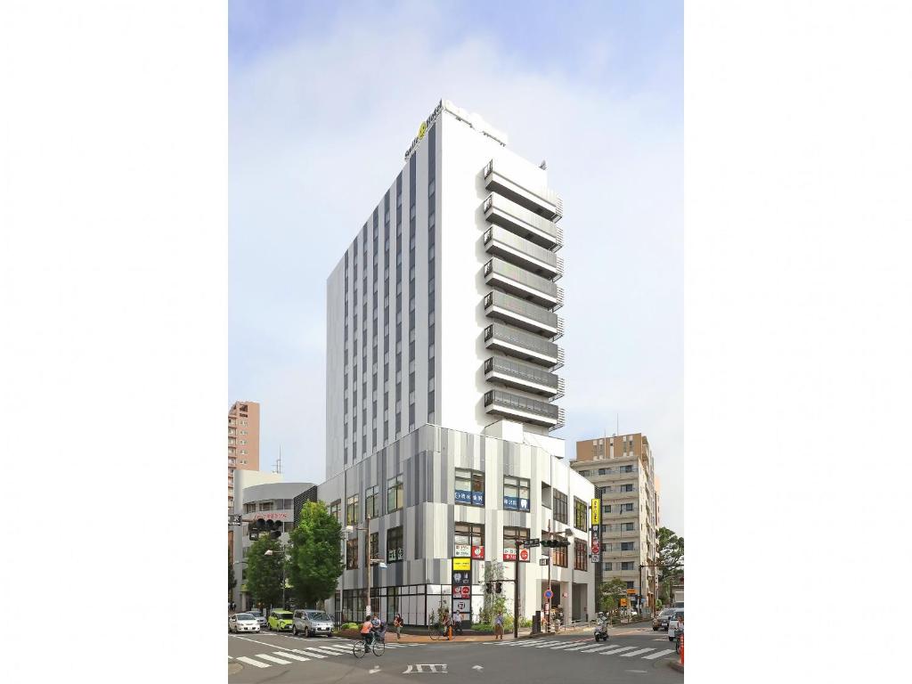 藤沢市にあるスマイルホテル湘南藤沢の白い高い建物の建築図