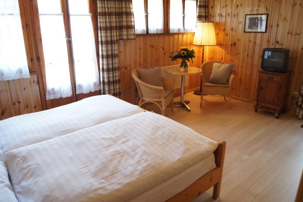 Postel nebo postele na pokoji v ubytování Hotel Alpina