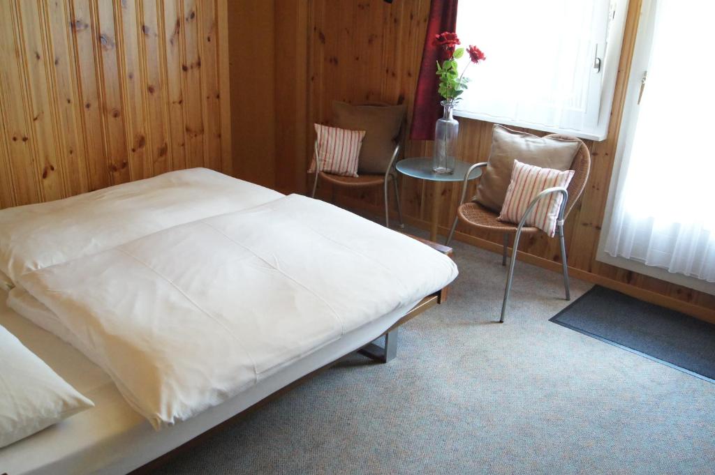 Postel nebo postele na pokoji v ubytování Hotel Alpina