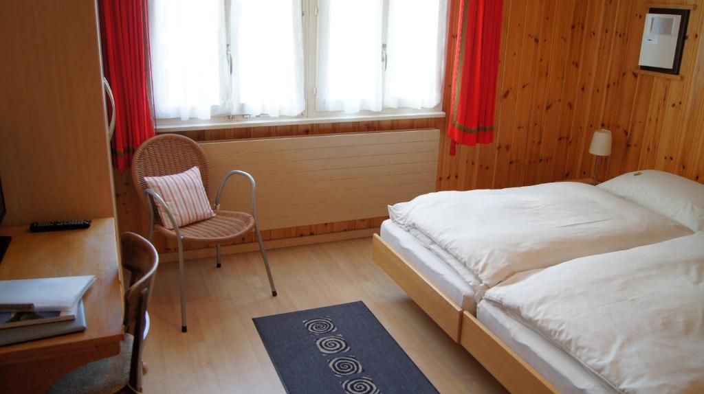 Postel nebo postele na pokoji v ubytování Hotel Alpina