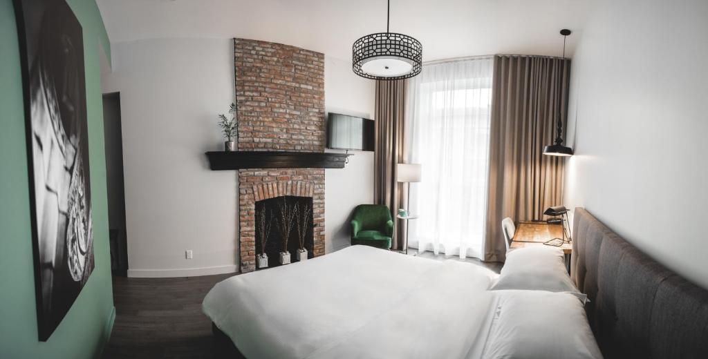 Postel nebo postele na pokoji v ubytování Hotel Oui GO!