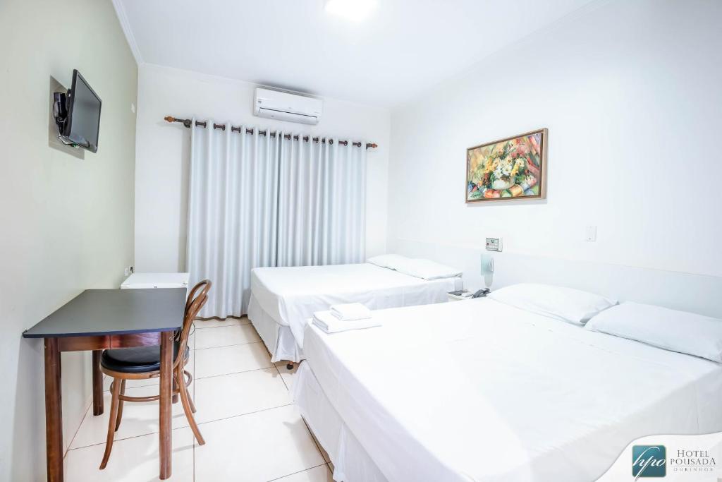 Postel nebo postele na pokoji v ubytování Hotel Pousada Ourinhos