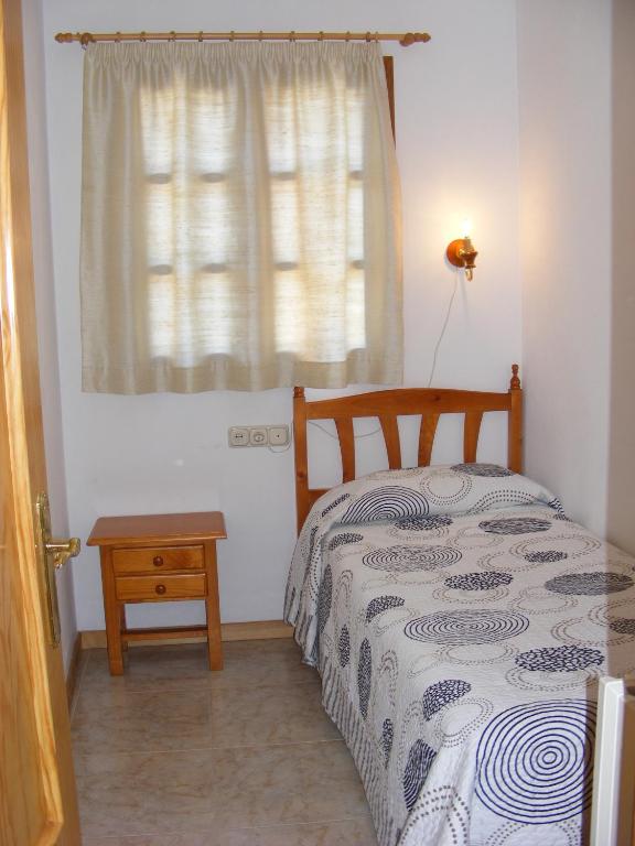 Posteľ alebo postele v izbe v ubytovaní Apartaments l'Arrel