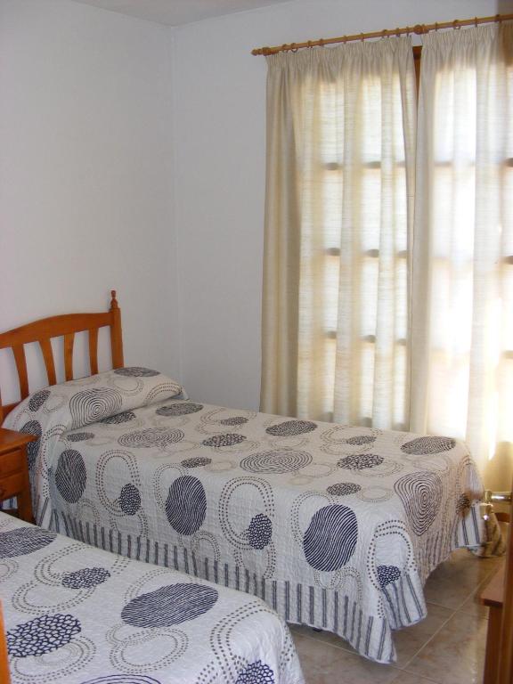 Posteľ alebo postele v izbe v ubytovaní Apartaments l'Arrel