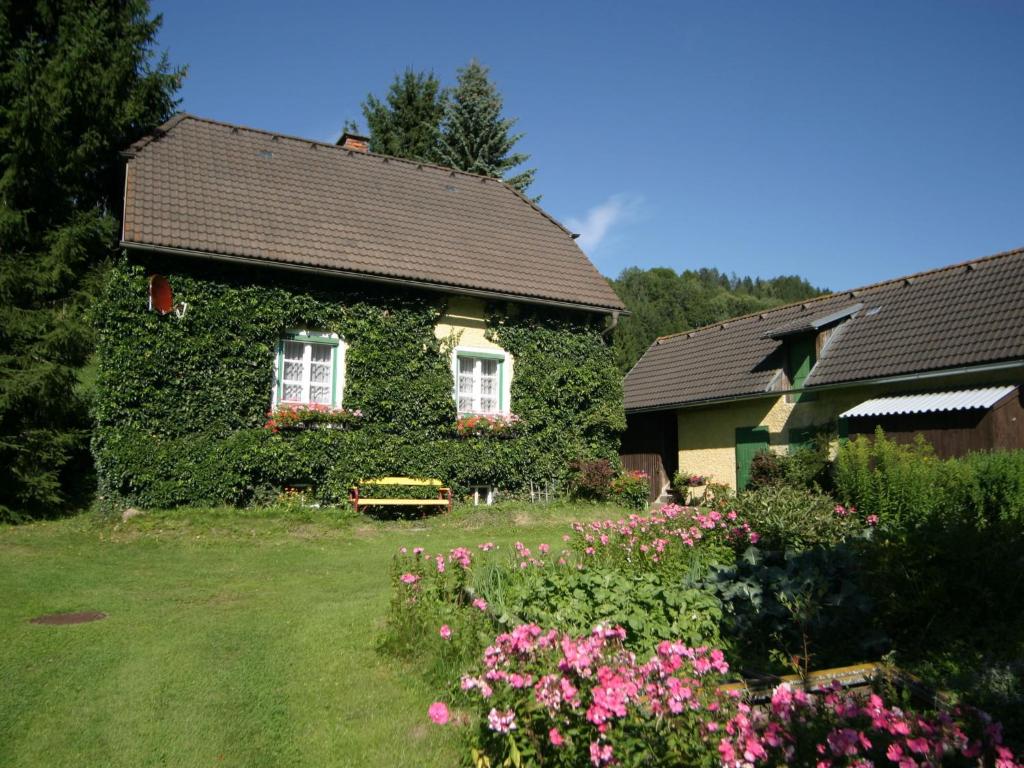 a house with a bunch of flowers in front of it at Holiday home in Scheifling near ski area in Scheifling